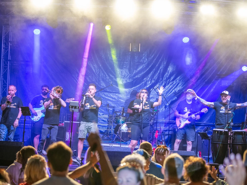 Corporate function band performing live on stage at Cheshire party