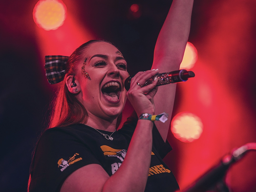 Female singer performing with corporate function band in Cheshire