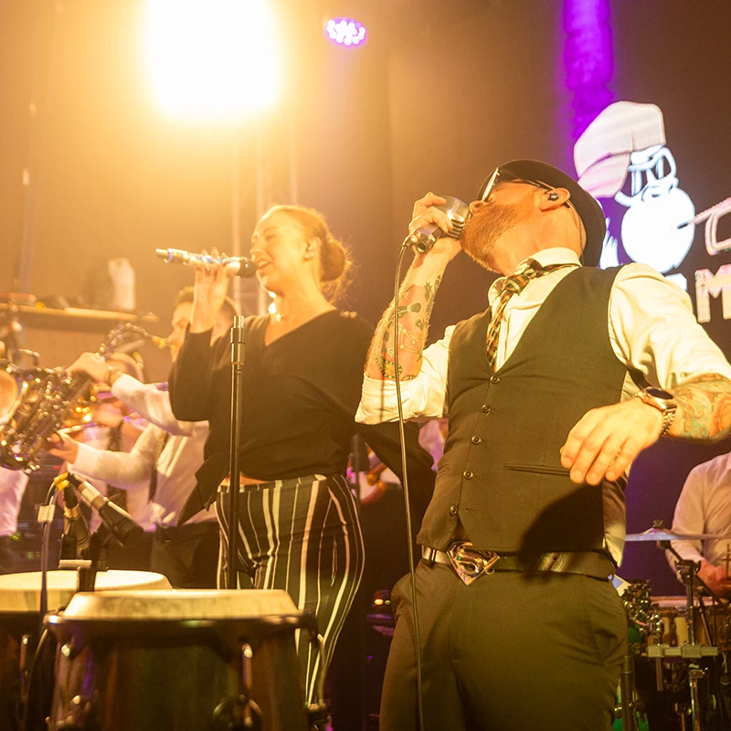 Brass Monkees live band performing at a corporate event