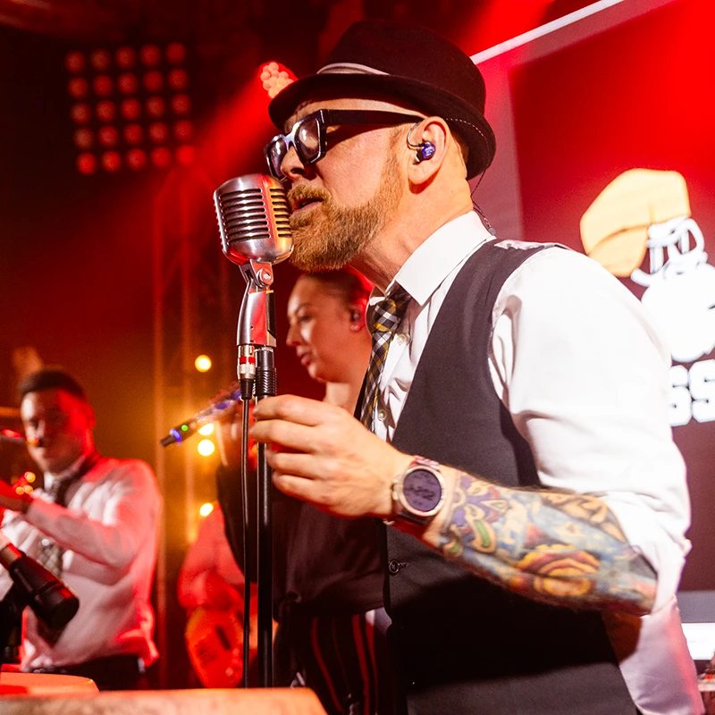 Brass Monkees party band performing live for a celebrating crowd