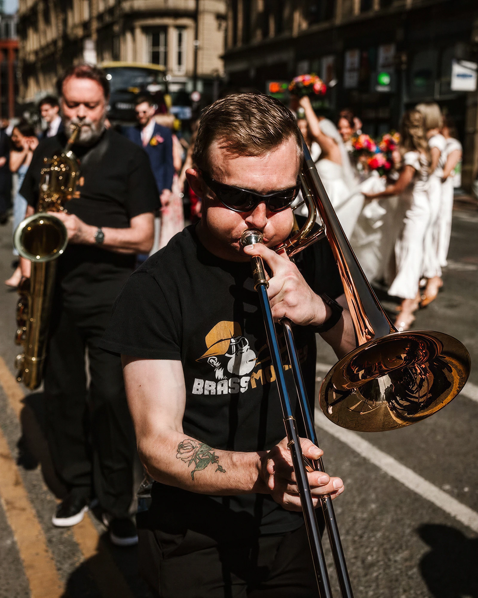 Brass Monkees roaming brass band playing trumpet, trombone and saxophones among guests