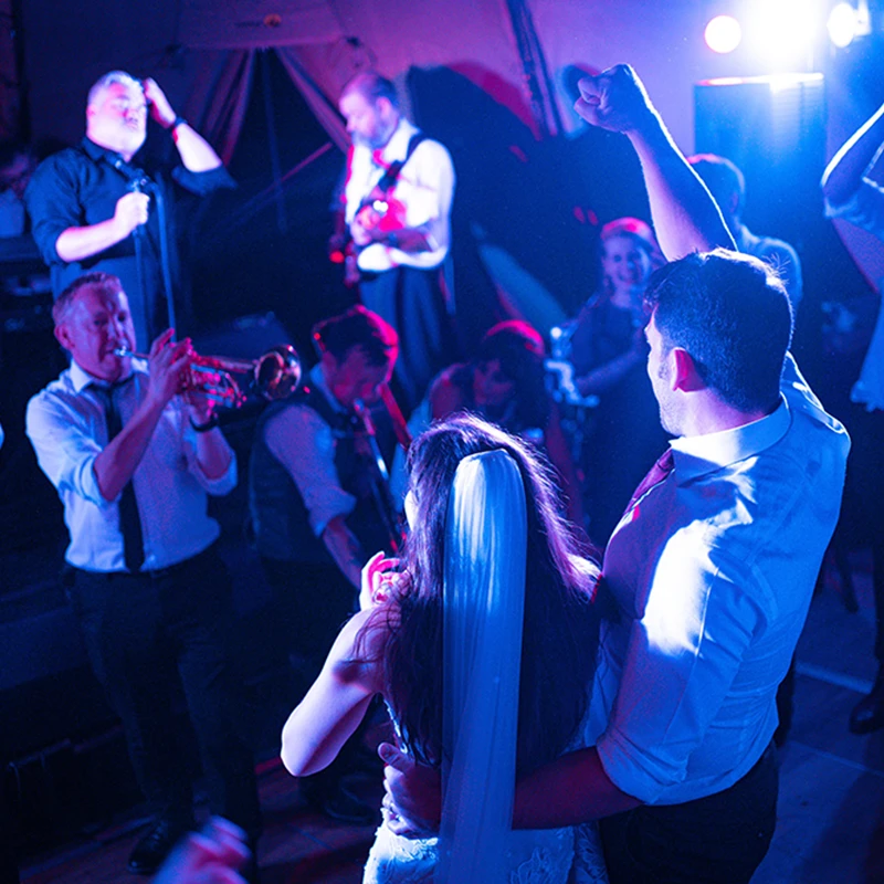Brass Monkees wedding band playing to a packed dance floor