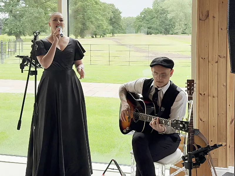 Acoustic singer and guitarist playing a relaxed live set
