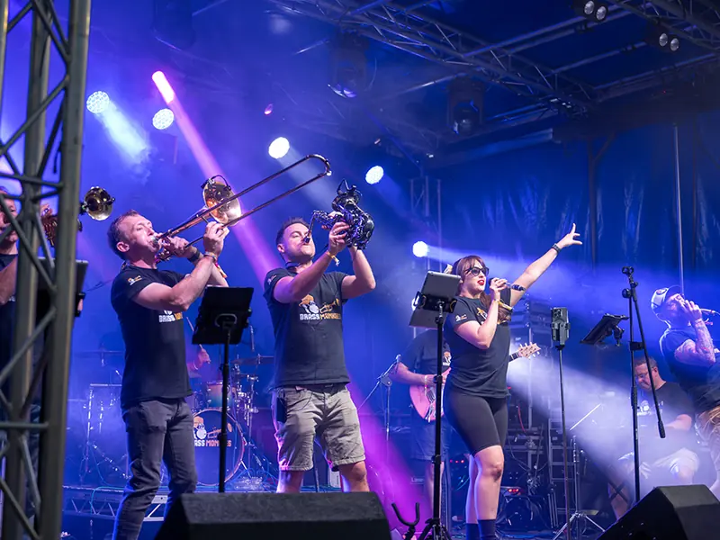 Brass Monkees on a large stage with professional lighting