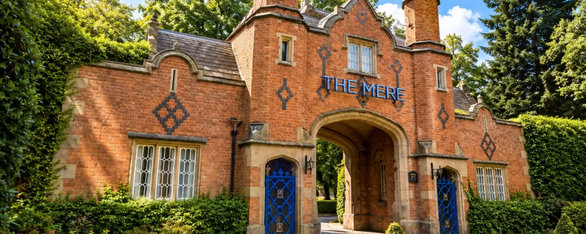 Red-brick gatehouse entrance to The Mere, now Fairmont Cheshire, near Knutsford