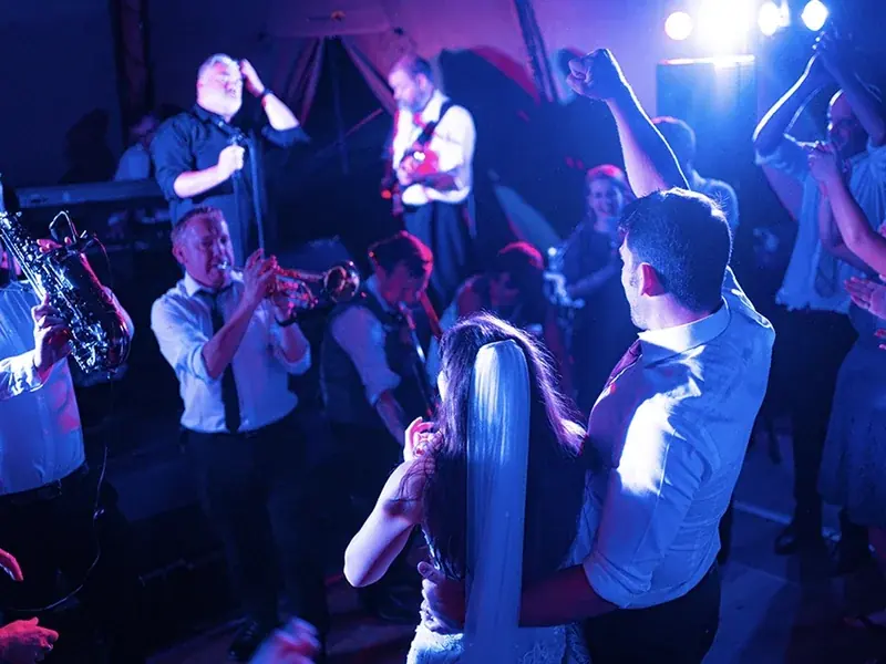Wedding guests dancing to a live band at a Shropshire wedding