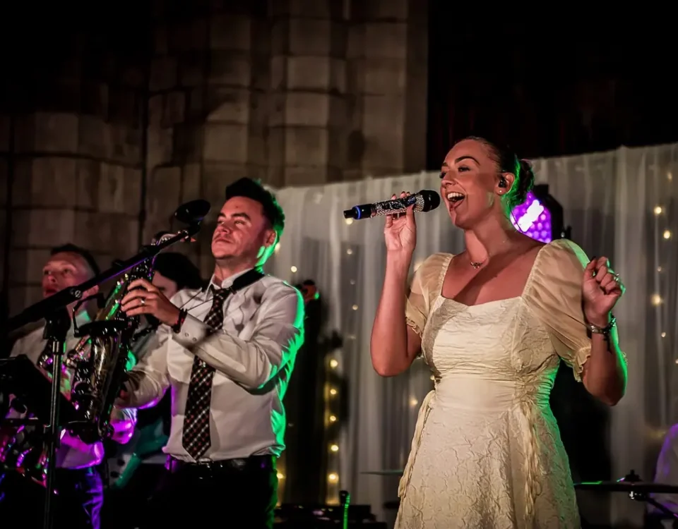 Brass Monkees singer and sax player performing live at a Manchester wedding venue